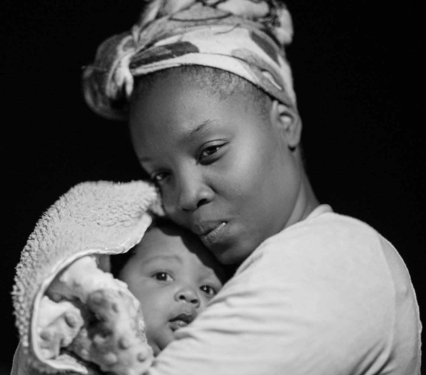 A mother holding her child close